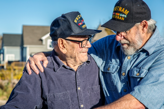 Vietnam Veterans embracing each other