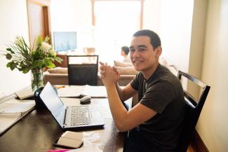 Teen Sitting in front of laptop