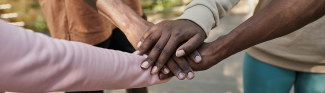 Group of people doing a stack of hands