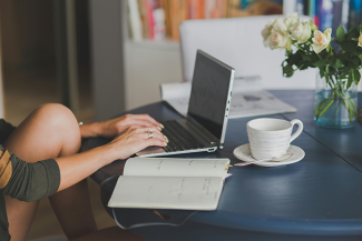 Person researching on laptop