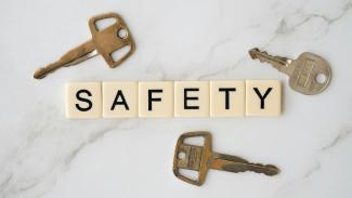 three keys surrounding letters that spell out safety